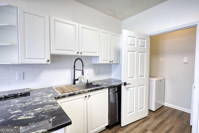 kitchen with white cabinets, washer / clothes dryer, tasteful backsplash, and a sink