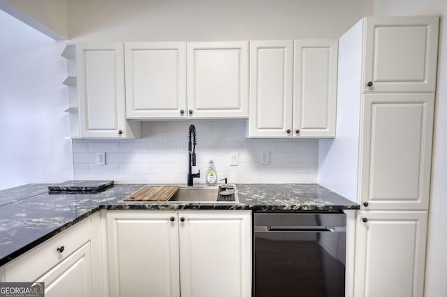 kitchen featuring white cabinets, dark stone countertops, backsplash, open shelves, and a sink