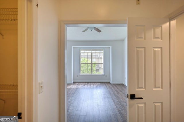 interior space featuring dark wood finished floors and baseboards