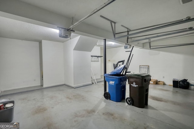 garage featuring a garage door opener