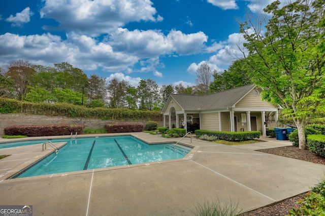 view of pool with a fenced in pool and a patio