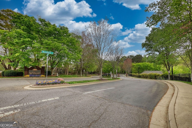 view of road with curbs