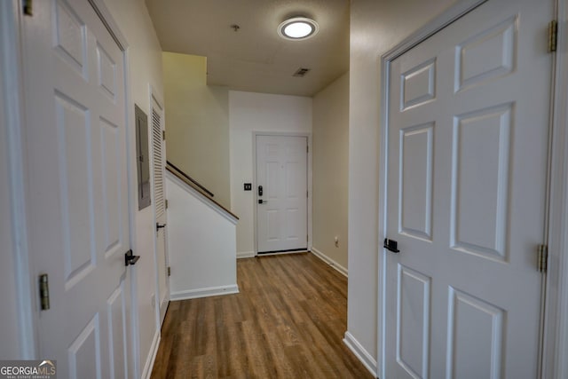 interior space featuring visible vents, baseboards, and wood finished floors