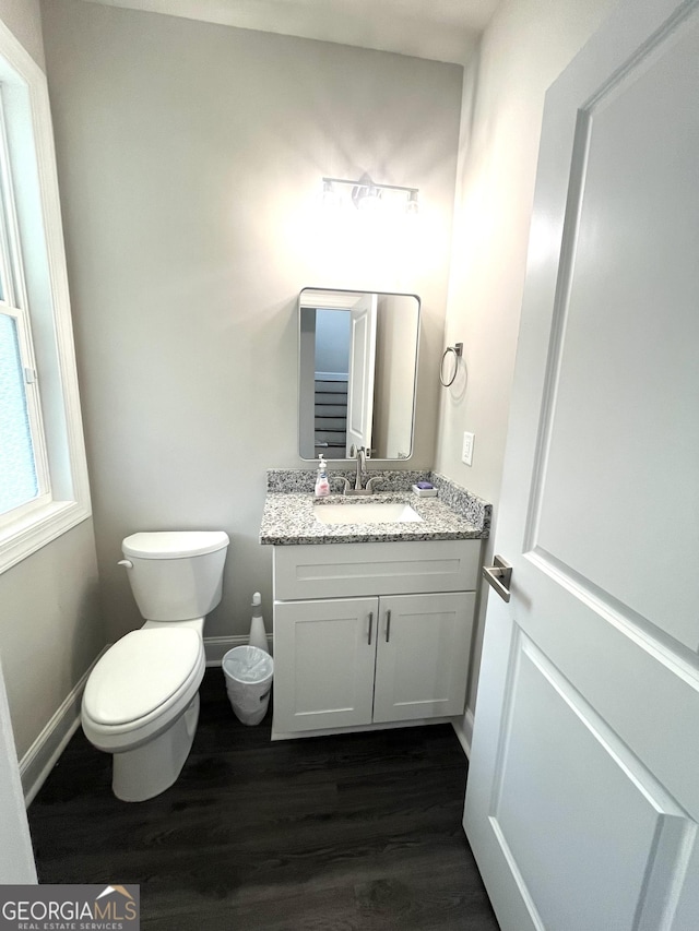 3 Highlander Trl SW, Rome, GA 30165 - half bath featuring wood finished floors, vanity, toilet, and baseboards