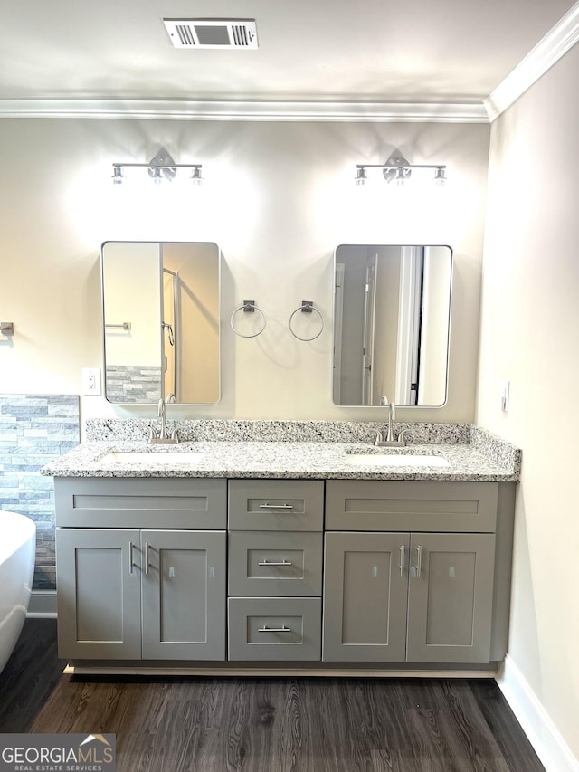 3 Highlander Trl SW, Rome, GA 30165 - bathroom with wood finished floors, crown molding, double vanity, baseboards, and a soaking tub