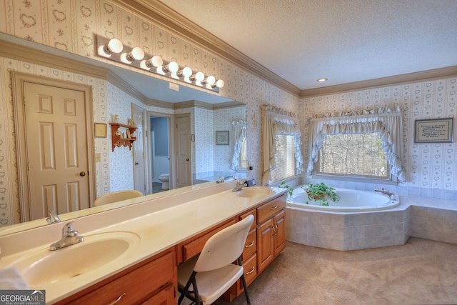 full bath with a sink, crown molding, a garden tub, a textured ceiling, and wallpapered walls