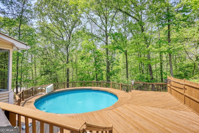 view of pool featuring a deck and a fenced in pool