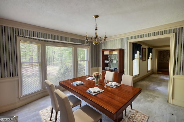 dining space with a chandelier, wallpapered walls, light colored carpet, and baseboards