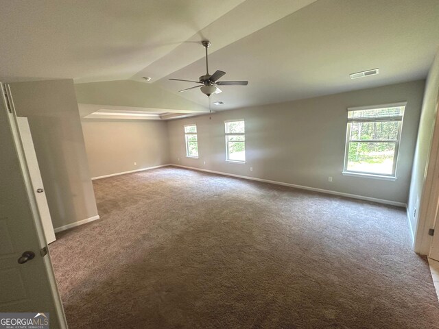 165 Jodi Pl, Locust Grove, GA 30248 - unfurnished room with carpet, lofted ceiling, visible vents, baseboards, and ceiling fan