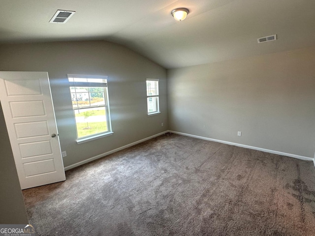 165 Jodi Pl, Locust Grove, GA 30248 - unfurnished room with baseboards, lofted ceiling, visible vents, and carpet