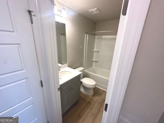 165 Jodi Pl, Locust Grove, GA 30248 - bathroom featuring wood finished floors, visible vents, shower / bath combination, toilet, and vanity