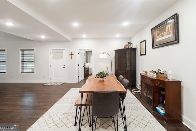 dining area with baseboards, dark wood-style floors, and recessed lighting