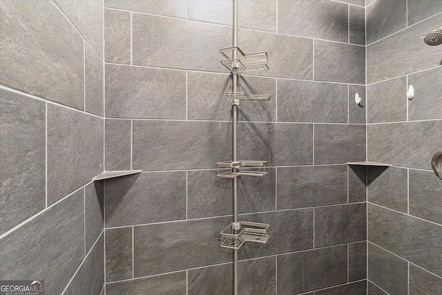 room details with a tile shower