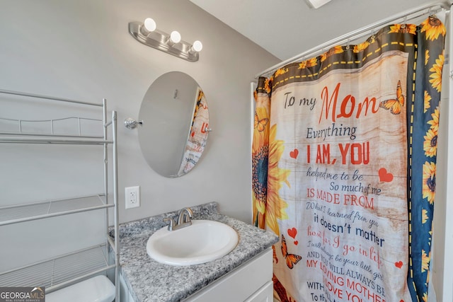 full bath with a shower with curtain and vanity