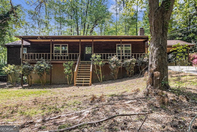 20 King Pl, Stockbridge, GA 30281 - view of front of house with a chimney, stairway, and a carport