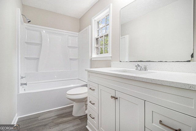 20 King Pl, Stockbridge, GA 30281 - full bathroom featuring wood finished floors, toilet, vanity, and shower / bathtub combination