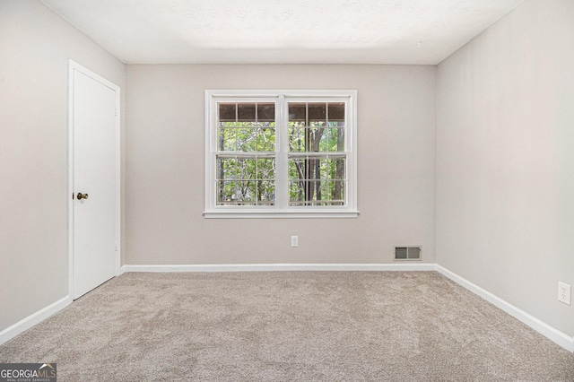 20 King Pl, Stockbridge, GA 30281 - empty room featuring carpet floors, visible vents, and baseboards