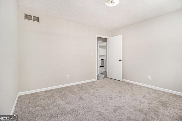 20 King Pl, Stockbridge, GA 30281 - empty room featuring light carpet, visible vents, and baseboards