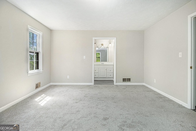 20 King Pl, Stockbridge, GA 30281 - unfurnished bedroom featuring multiple windows, visible vents, and carpet