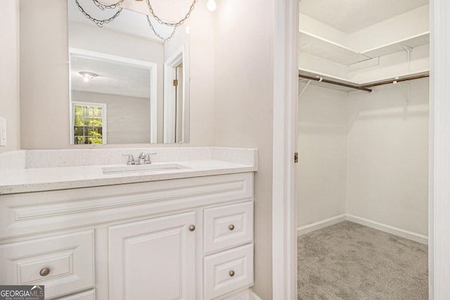20 King Pl, Stockbridge, GA 30281 - bathroom featuring vanity and a spacious closet