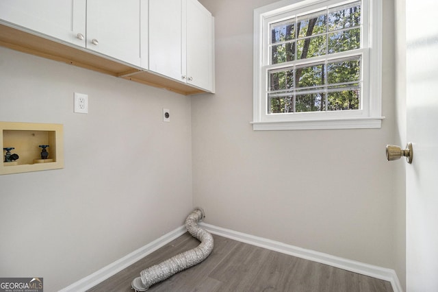 20 King Pl, Stockbridge, GA 30281 - washroom with wood finished floors, baseboards, electric dryer hookup, cabinet space, and washer hookup