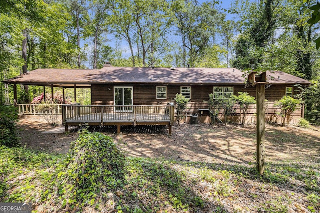 20 King Pl, Stockbridge, GA 30281 - back of house featuring a chimney and a deck