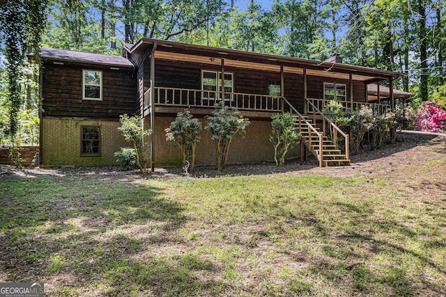 20 King Pl, Stockbridge, GA 30281 - rear view of house featuring a lawn, stairway, and brick siding