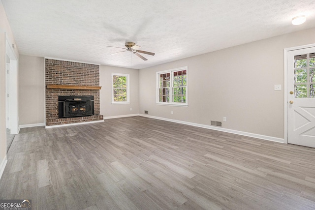 20 King Pl, Stockbridge, GA 30281 - unfurnished living room with wood finished floors, a ceiling fan, and baseboards