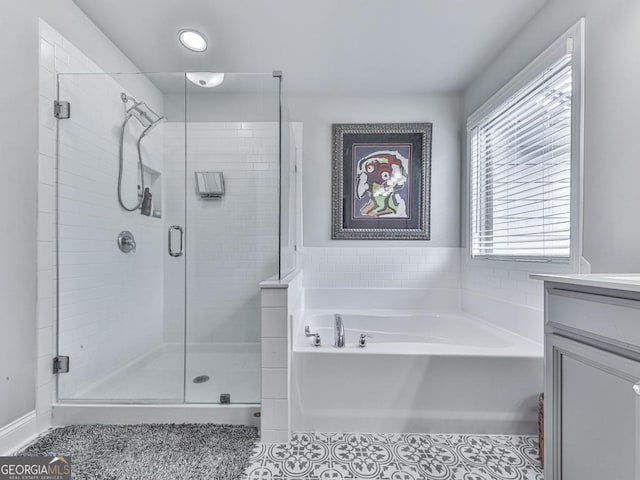 130 Maple Creek Way, Woodstock, GA 30188 - full bathroom with vanity, tile patterned flooring, a stall shower, and a bath