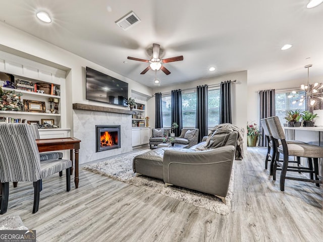 130 Maple Creek Way, Woodstock, GA 30188 - living room featuring visible vents, wood finished floors, a wealth of natural light, and a fireplace