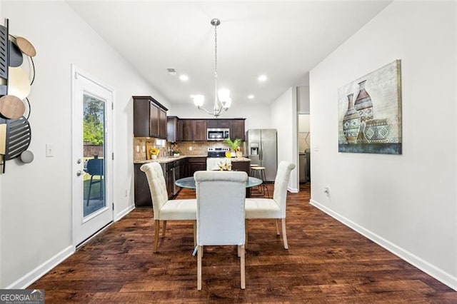 dining room with dark wood-style flooring, baseboards, a notable chandelier, visible vents, and recessed lighting