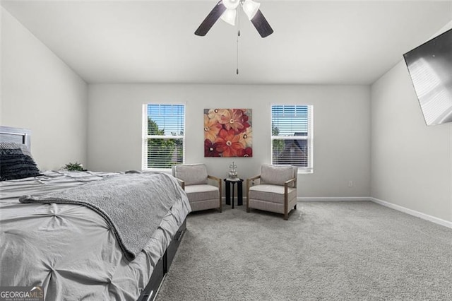 bedroom featuring baseboards, carpet floors, and ceiling fan