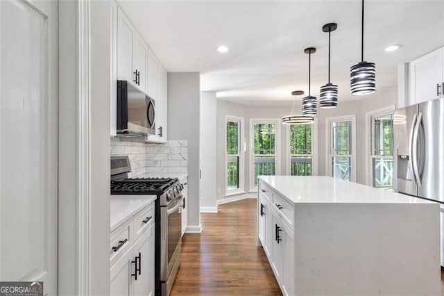 100 Little Ridge Rd, Berkeley Lake, GA 30096 - kitchen featuring stainless steel appliances, dark wood-style floors, recessed lighting, backsplash, and a kitchen island