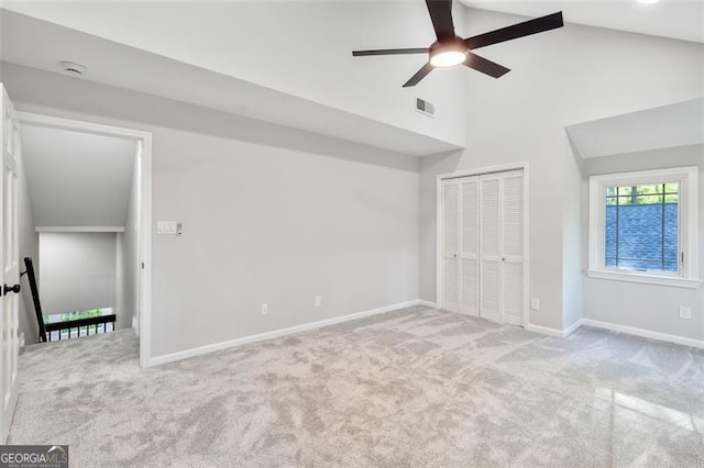 100 Little Ridge Rd, Berkeley Lake, GA 30096 - unfurnished bedroom featuring carpet flooring, a closet, high vaulted ceiling, and ceiling fan