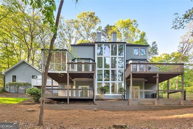 100 Little Ridge Rd, Berkeley Lake, GA 30096 - back of house with a wooden deck and a chimney