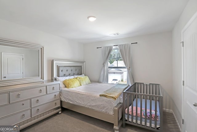 bedroom with carpet floors and visible vents