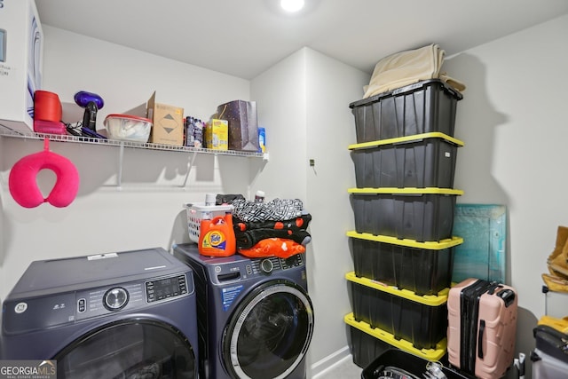 washroom with laundry area and washer and dryer