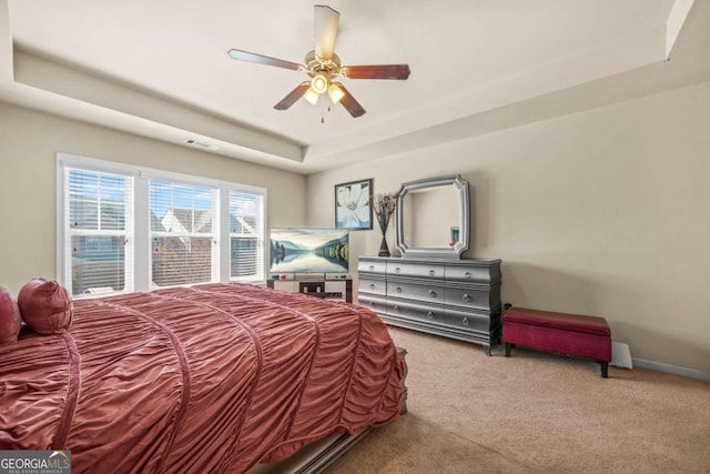 5030 Breezewood Cir, Alpharetta, GA 30004 - carpeted bedroom featuring a raised ceiling, visible vents, baseboards, and ceiling fan