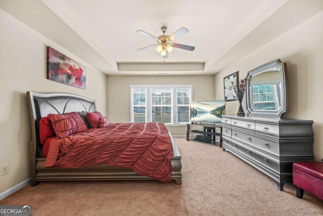5030 Breezewood Cir, Alpharetta, GA 30004 - bedroom featuring carpet floors, a ceiling fan, and a tray ceiling