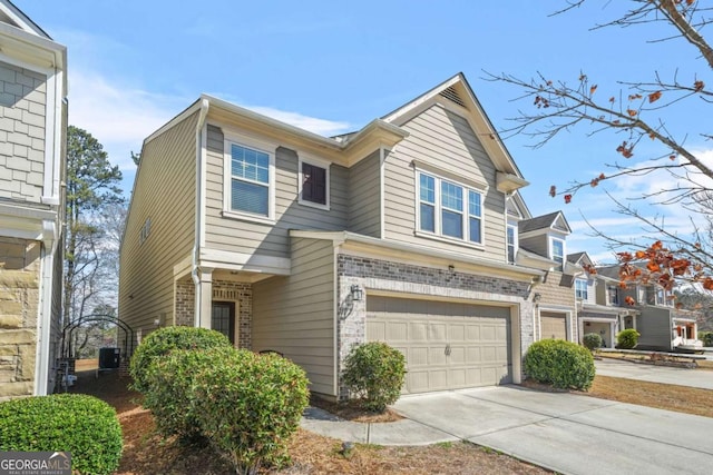 5030 Breezewood Cir, Alpharetta, GA 30004 - view of front of house with brick siding, an attached garage, and driveway
