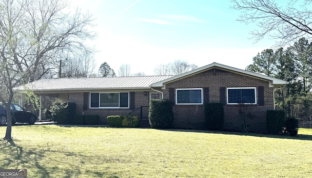 3065 County Road 69, Centre, AL 35960 - single story home with brick siding, a front yard, and metal roof