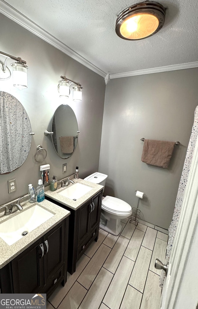 3065 County Road 69, Centre, AL 35960 - full bath with crown molding, vanity, toilet, a textured ceiling, and wood finish floors