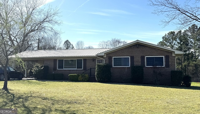 3065 County Road 69, Centre, AL 35960 - ranch-style home with brick siding, a front lawn, and metal roof