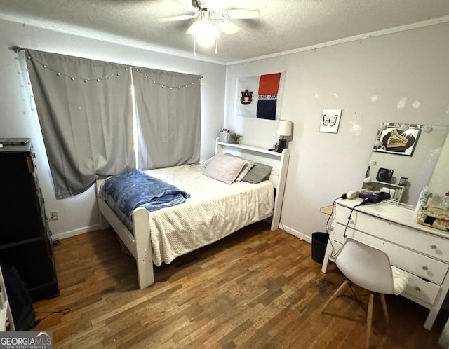 3065 County Road 69, Centre, AL 35960 - bedroom with wood finished floors, ornamental molding, a textured ceiling, ceiling fan, and baseboards