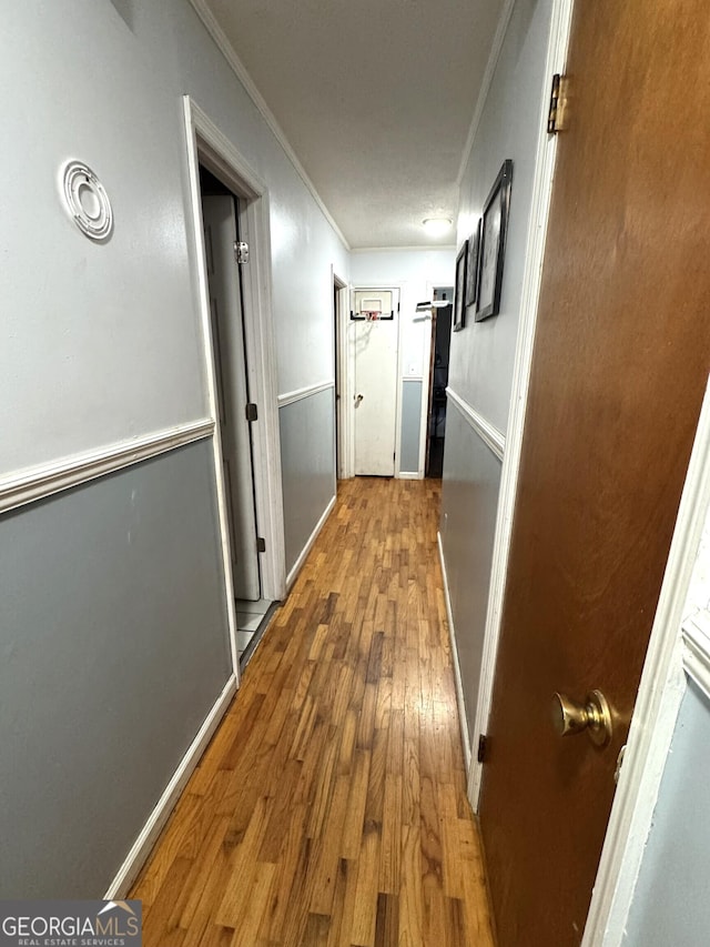 3065 County Road 69, Centre, AL 35960 - corridor with crown molding, wood finished floors, and baseboards