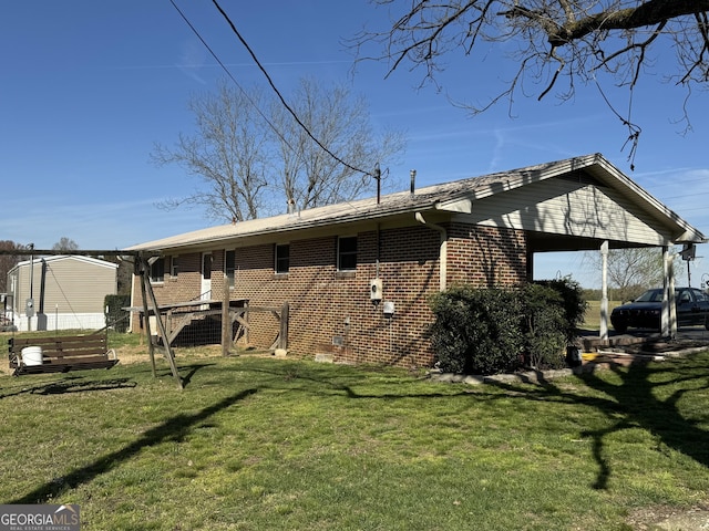 3065 County Road 69, Centre, AL 35960 - rear view of house with brick siding and a lawn