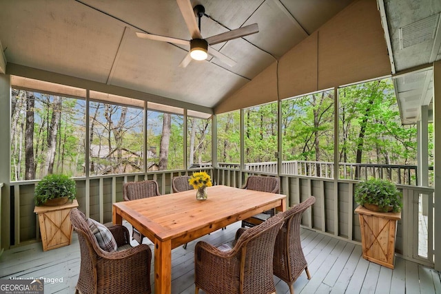 wooden deck featuring outdoor dining area