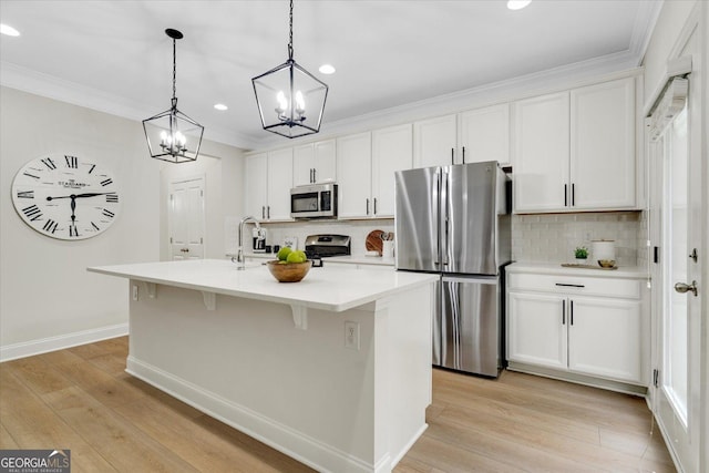 4240 Spring Rdg, Cumming, GA 30028 - kitchen with stainless steel dishwasher, light wood-style flooring, a sink, white cabinetry, and recessed lighting
