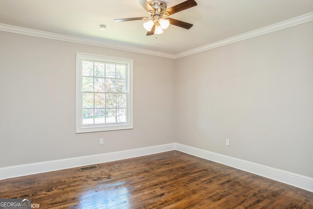 1531 E Broad St, Greensboro, GA 30642 - empty room with baseboards, visible vents, and dark wood-type flooring