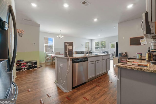 11893 Lovejoy Crossing Blvd, Hampton, GA 30228 - kitchen featuring appliances with stainless steel finishes, dark wood finished floors, a chandelier, recessed lighting, and a kitchen island with sink